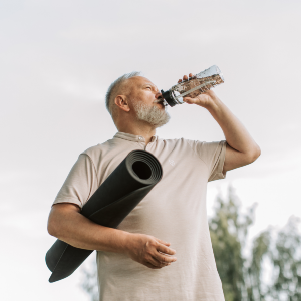 Old athlete drinking for his healthspan