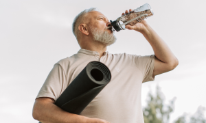 Old athlete drinking for his healthspan